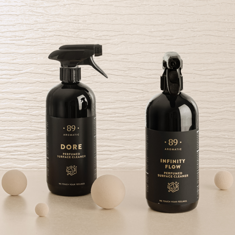 89 Aromatic DORE surface cleaner beside Infinity Flow in a neutral luxury setting
